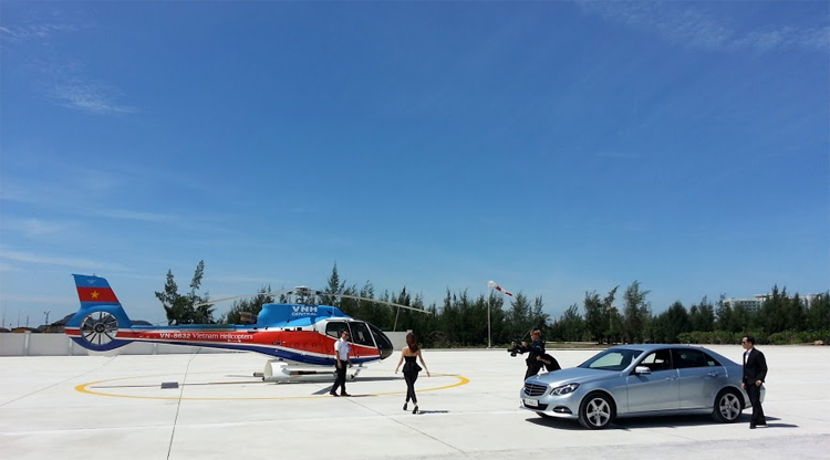 luxury helicopter and car